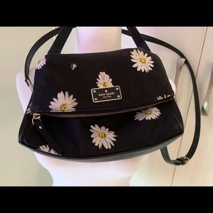 Black Kate Spade Daisy and Bee’s purse.